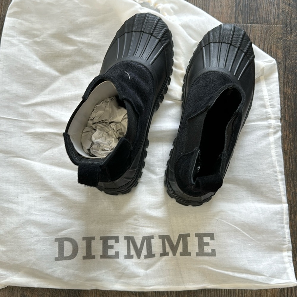 NWT and dust bag.  Black suede & rubber soles pull on booties.